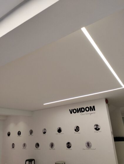 Vodom showroom project with recessed linear lights and downlight